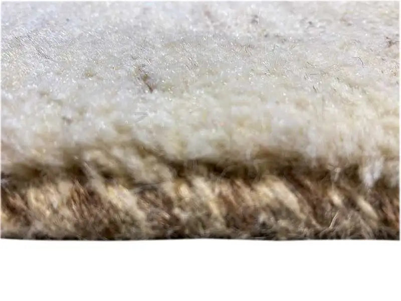 Carpet surface with a light, speckled pile and darker stripes