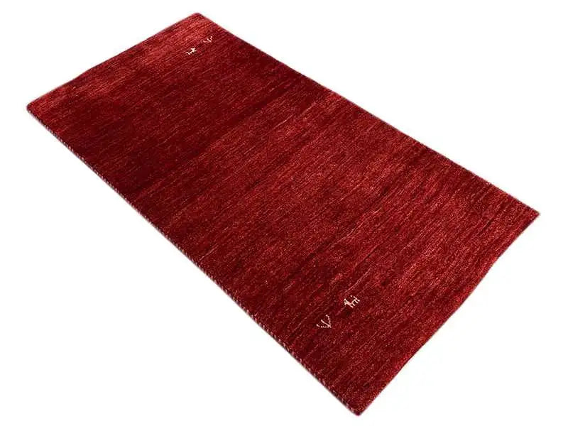 Gabbeh rug 133x70 cm, reddish-brown rug with a fine, mottled textured surface