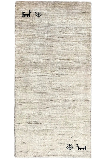 Gabbeh rug 135x65 cm, beige pile with dark corner ornamentation and a flat-woven design.