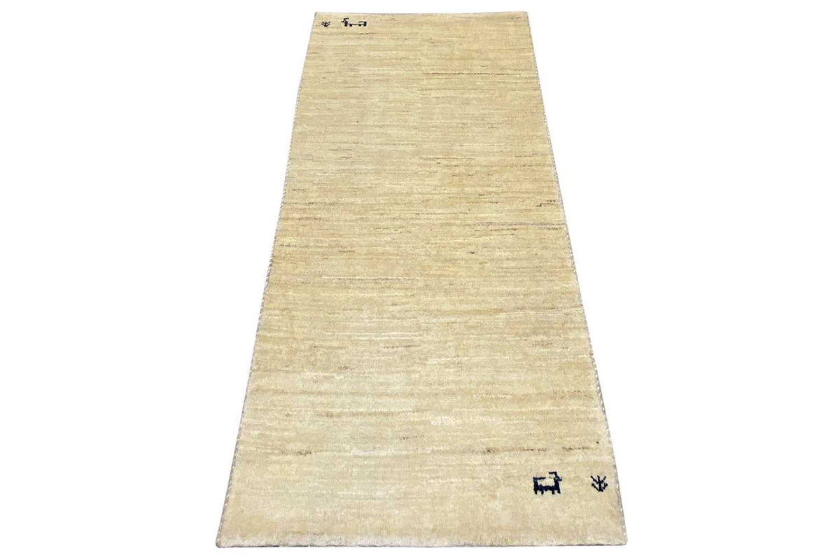 Gabbeh rug runner in light beige, blue pattern along the lower edge