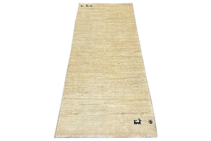 Gabbeh rug runner in light beige, blue pattern along the lower edge