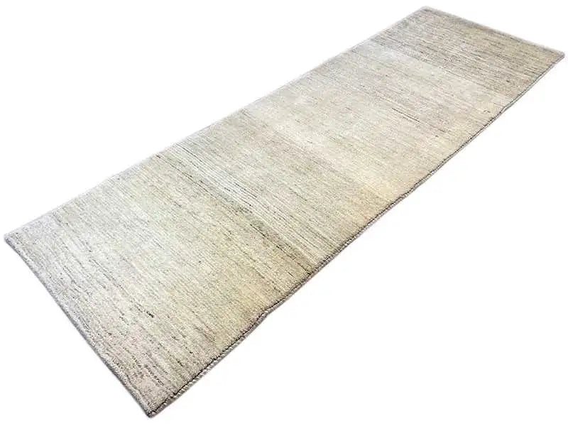 Beige Gabbeh rug with a subtle pattern and straight edge