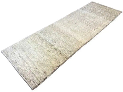 Beige Gabbeh rug with a subtle pattern and straight edge