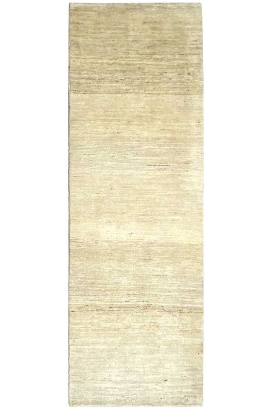 Rectangular Gabbeh rug in a light beige shade, laid flat