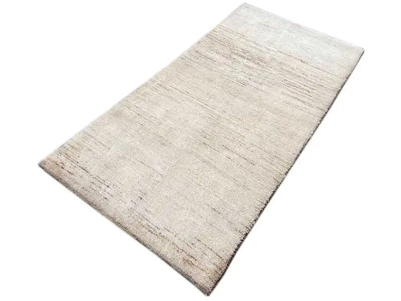 Gabbeh rug, rectangular, beige mottled design with a fine woven texture, diagonal