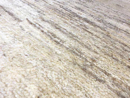 Gabbeh rug, surface in detail: beige mottled fabric with fine stripes
