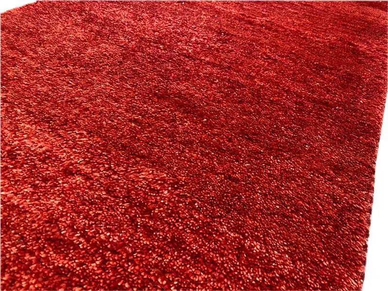 Gabbeh rug, red pile surface with a dense, fine weave pattern