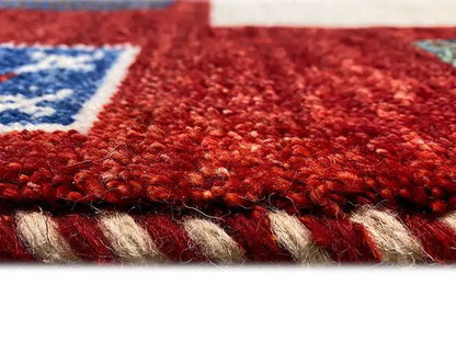 Red Gabbeh rug, close-up of the dense pile and bound edge