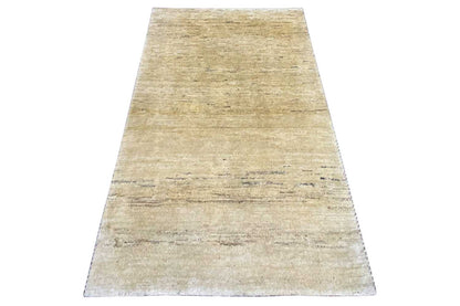 Runner-style Gabbeh rug in natural beige with a fine, even weave.