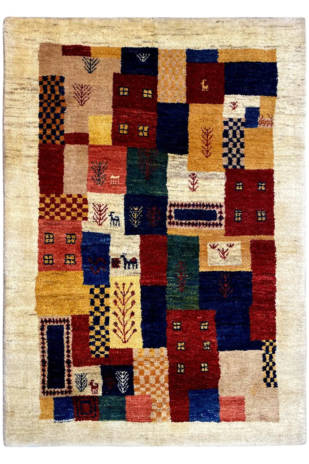 Gabbeh rug with a square patchwork pattern and bold colors on a beige background