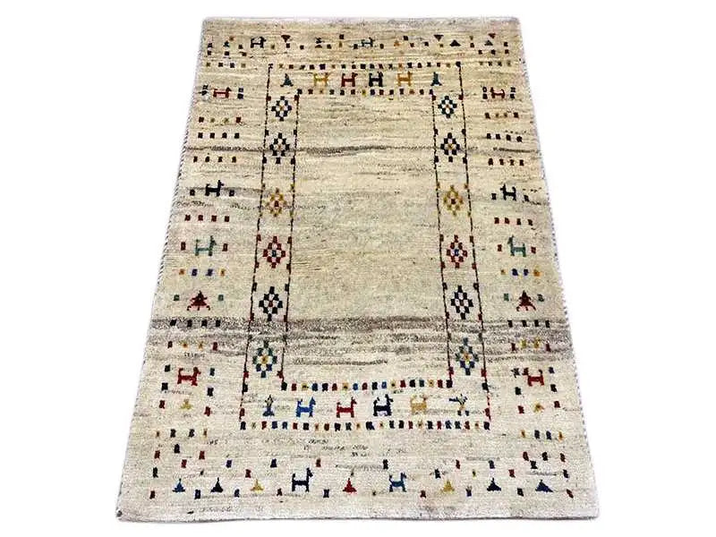 Gabbeh rug with a beige background, rectangular medallion, and colorful decorative stripes