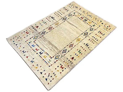Gabbeh rug with a beige background, rectangular medallion, and ornamental border