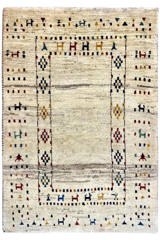 Gabbeh rug with a beige background, borders, and a central rectangular medallion