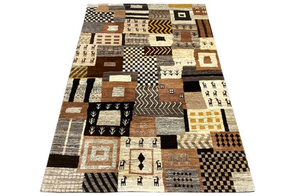 Rug with a bold geometric pattern made of patchwork blocks in beige, brown, and black