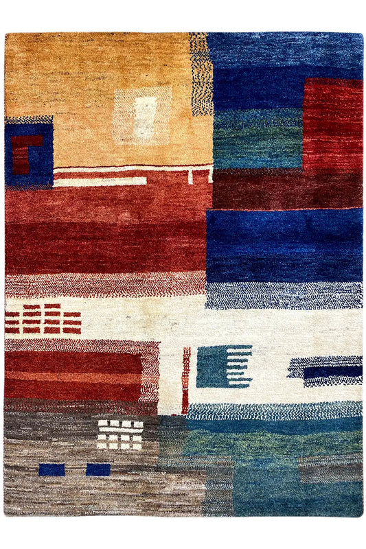 Gabbeh rug front view with patchwork squares and lines in red, blue, and beige