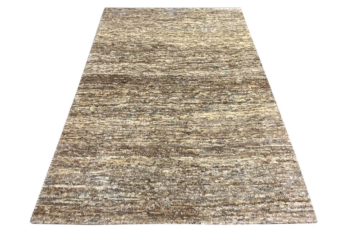 Gabbeh rug, flared trapezoidal shape: mottled beige-gray-brown textured pattern
