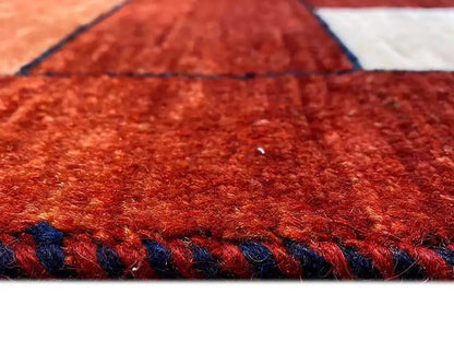 Gabbeh rug, close-up of pile and fringe in shades of red