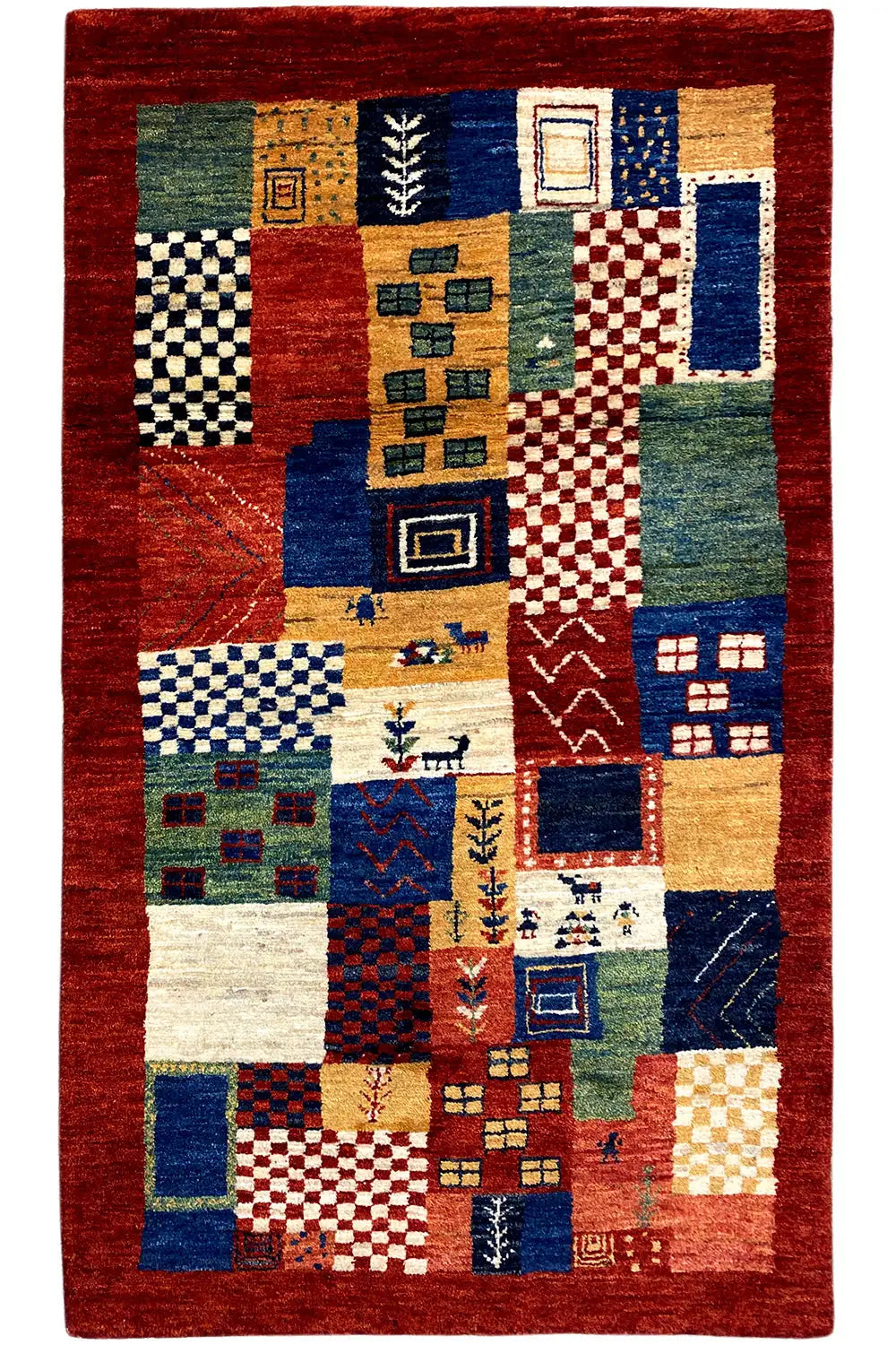 Gabbeh rug with a patchwork pattern in red, blue, green, and beige, rectangular, flat-weave