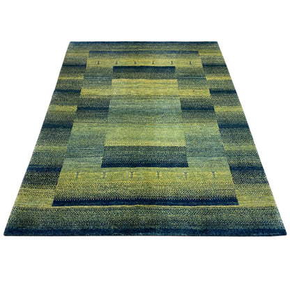 Green gabbeh rug with a geometric square layout, rectangular, laid flat.