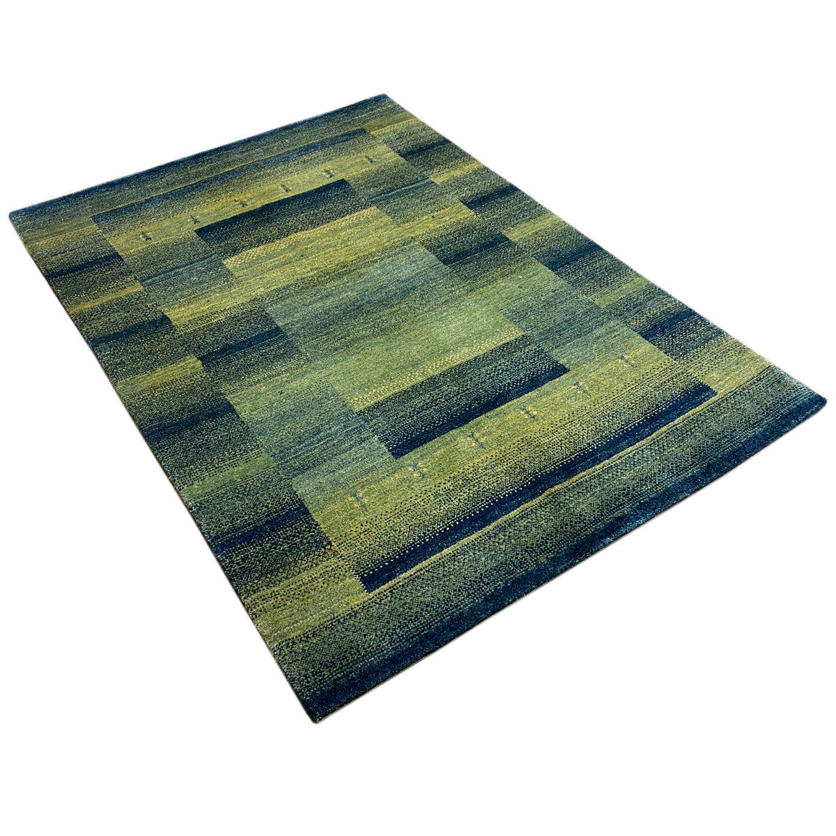 Green gabbeh rug with checkerboard-like rectangles, diagonal view, flat.