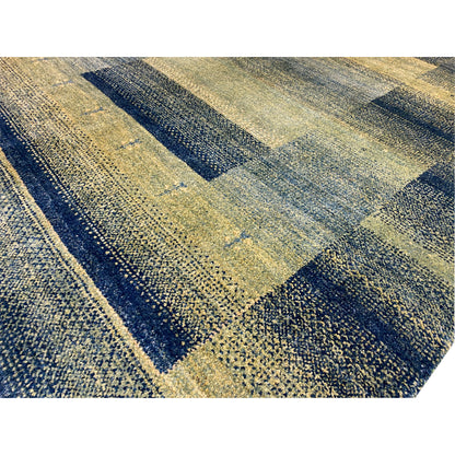 Gabbeh rug green close-up: mottled woven pattern with rectangular sections.