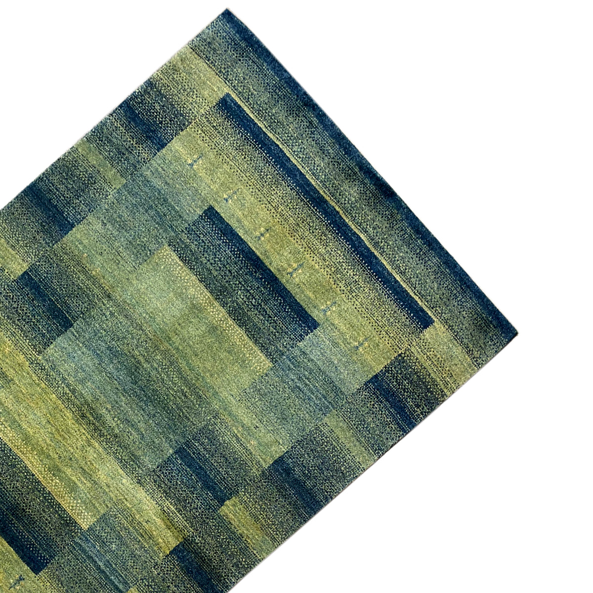 Green gabbeh rug detail: horizontal and vertical rectangular shapes in a grid.