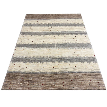 Rectangular Gabbeh rug with a striped pattern in beige, gray, and darker accents