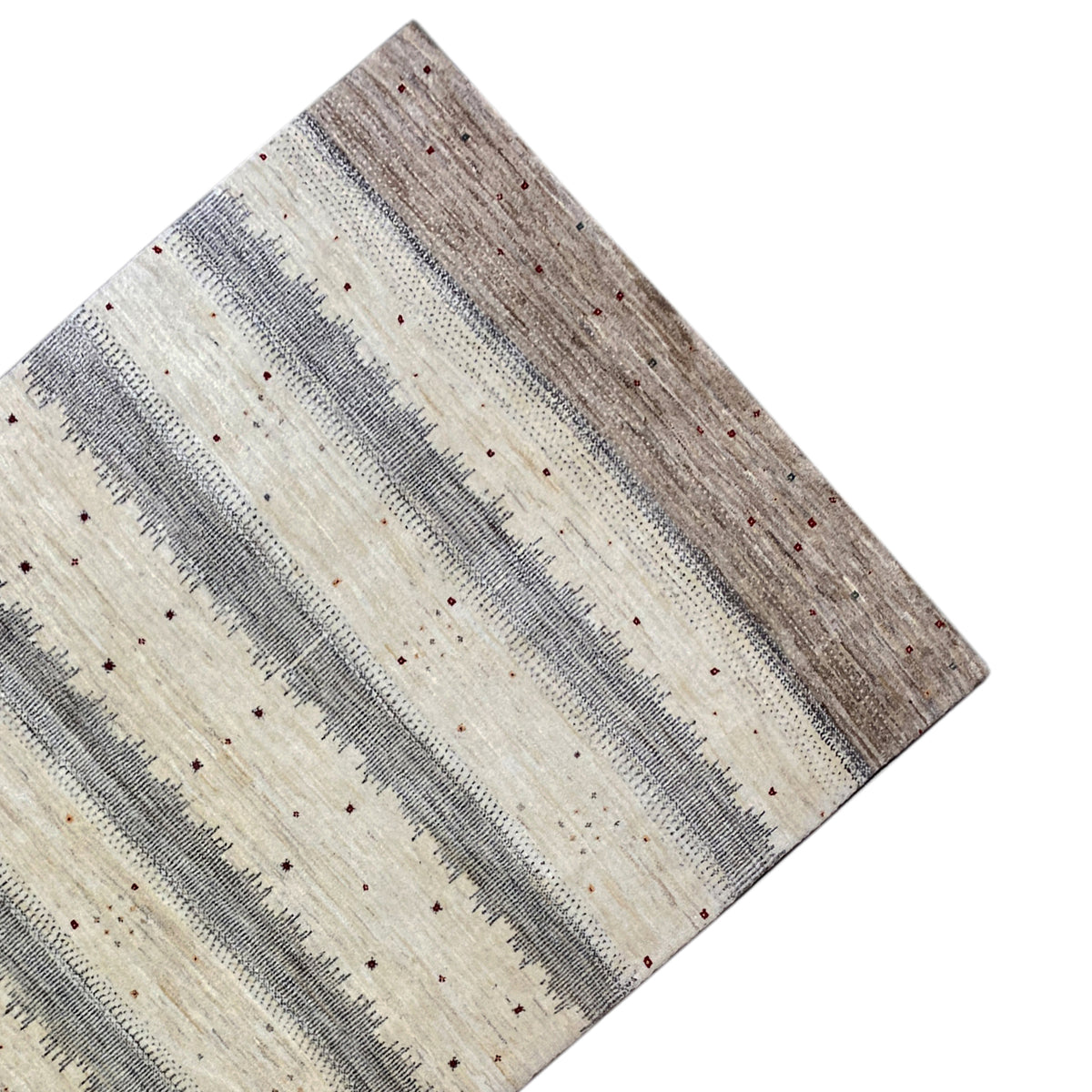 Gabbeh rug at an angle: light beige stripes with gray-brown contrasts