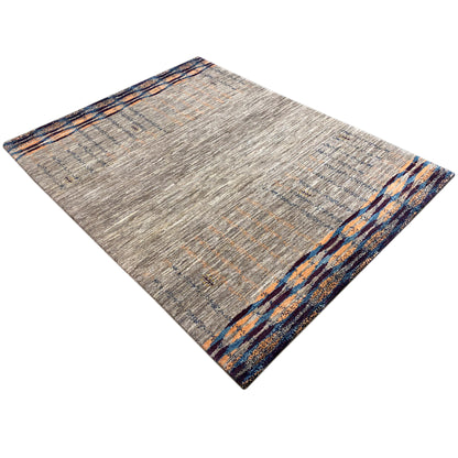 Gray gabbeh rug with a rectangular pattern and blue-orange border trim