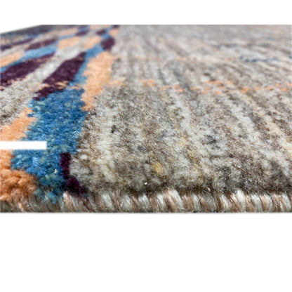 Carpet detail with pile: gray surface and colorful fiber accents at the edge