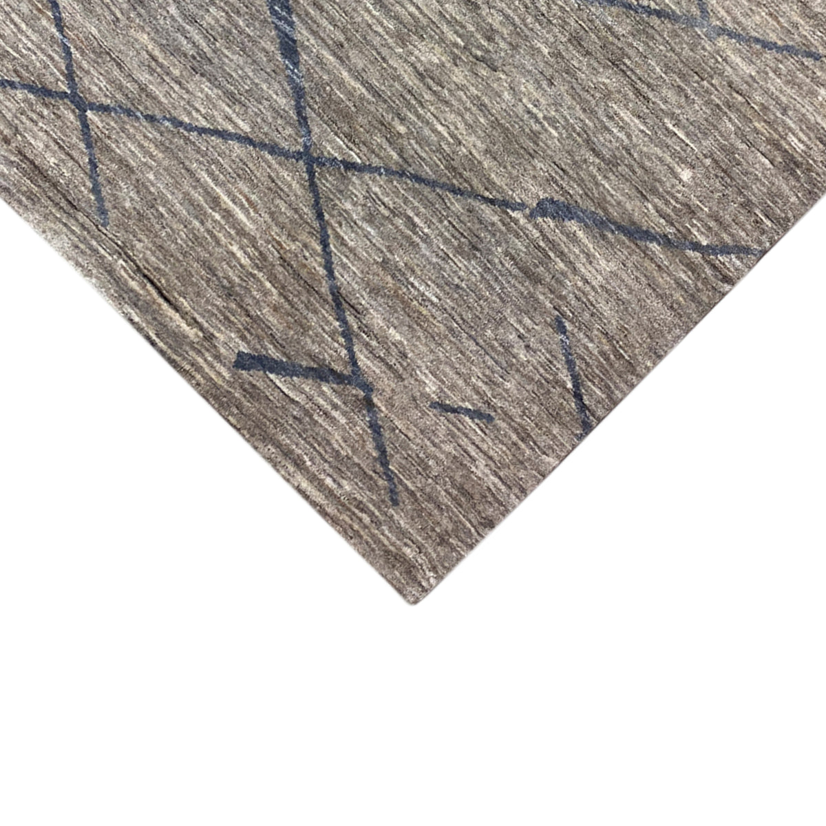 Gabbeh rug, close-up: gray pile with a blue diamond grid