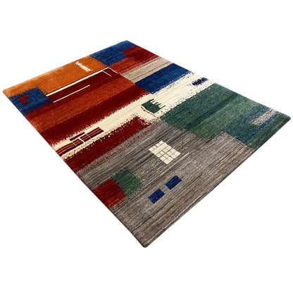 Gabbeh rug 205x154 cm, diagonal view with a colorful patchwork design and accents