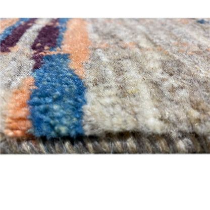 Texture close-up: dense gray pile with a blue and orange color gradient