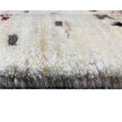 Close-up of the carpet pile: soft, light surface with dark accents