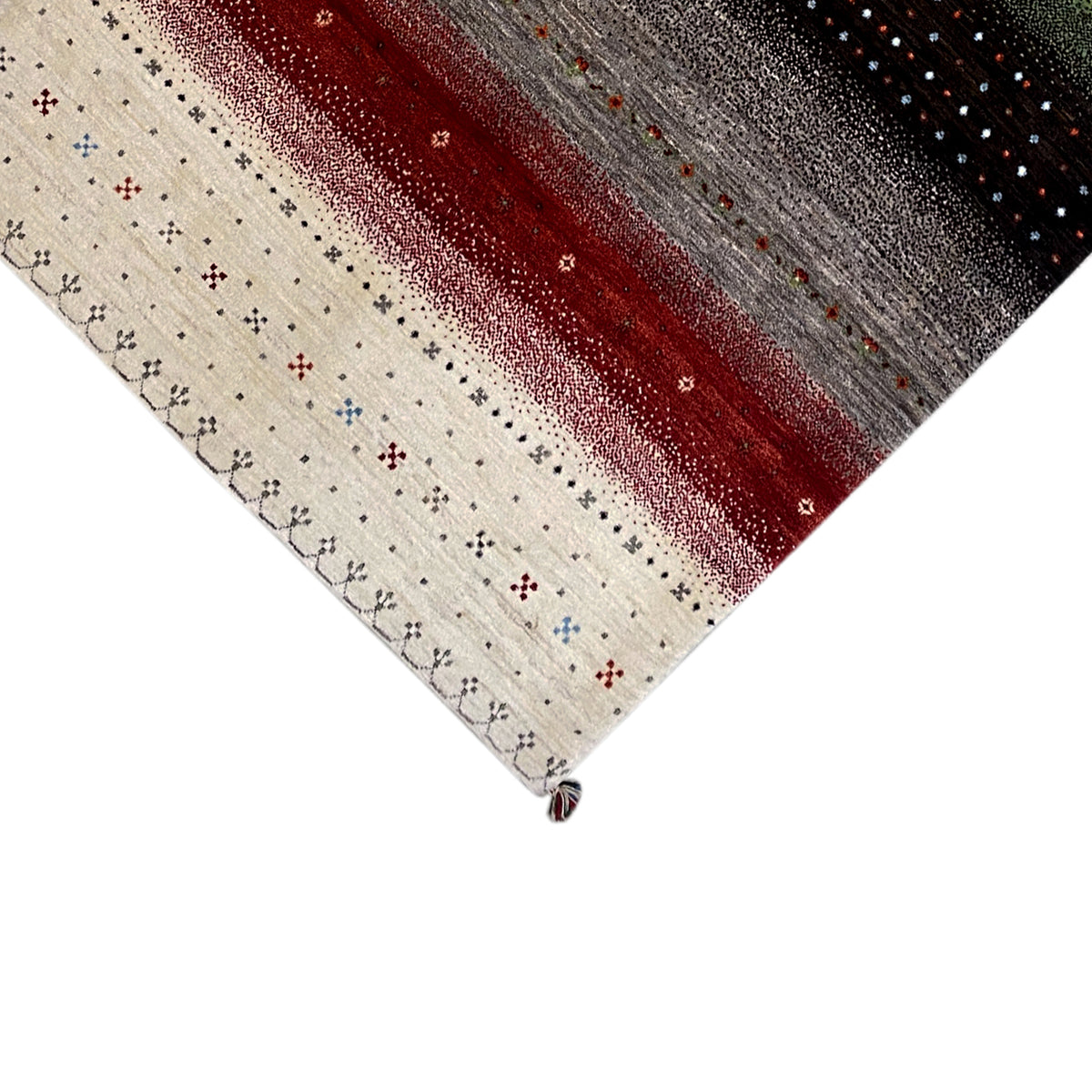 Gabbeh rug corner with border: cream-colored field with small crosses and dots