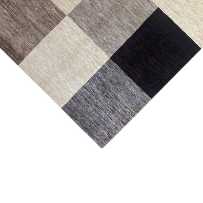 Gabbeh rug 243x169 cm, corner area with a checkered pattern in gray, cream, and black