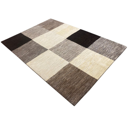 Gabbeh rug in a square view with a checkered pattern in beige, gray, and black