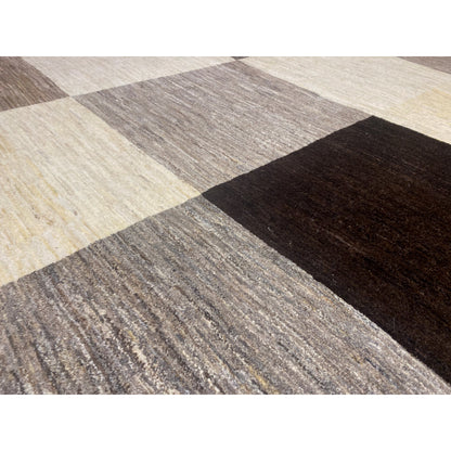 Gabbeh rug detail: textured pile in beige, gray, and dark block sections