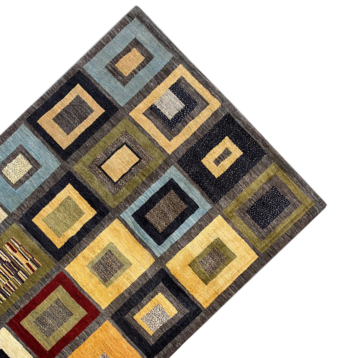 Gabbeh rug corner with geometric squares in teal, yellow, black, and red