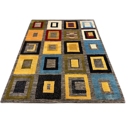 Gabbeh rug with a geometric square pattern in yellow, blue, black, and gray