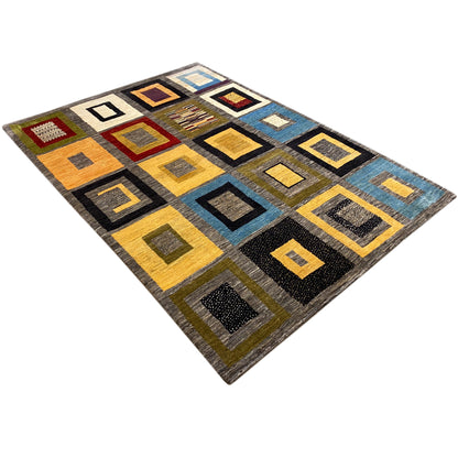 Gabbeh rug with a checkered design of colorful squares in gold, blue, and black