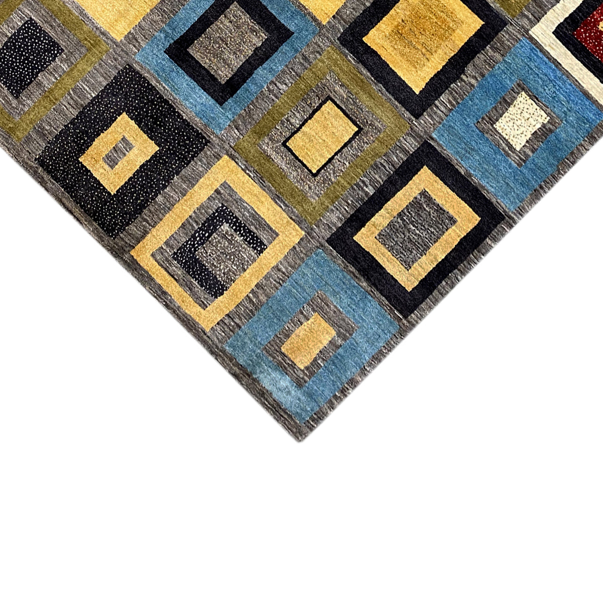 Gabbeh rug corner view with colorful diamond motifs and golden border lines