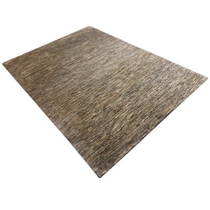 Rectangular Gabbeh rug, beige mottled weave pattern, presented at an angle
