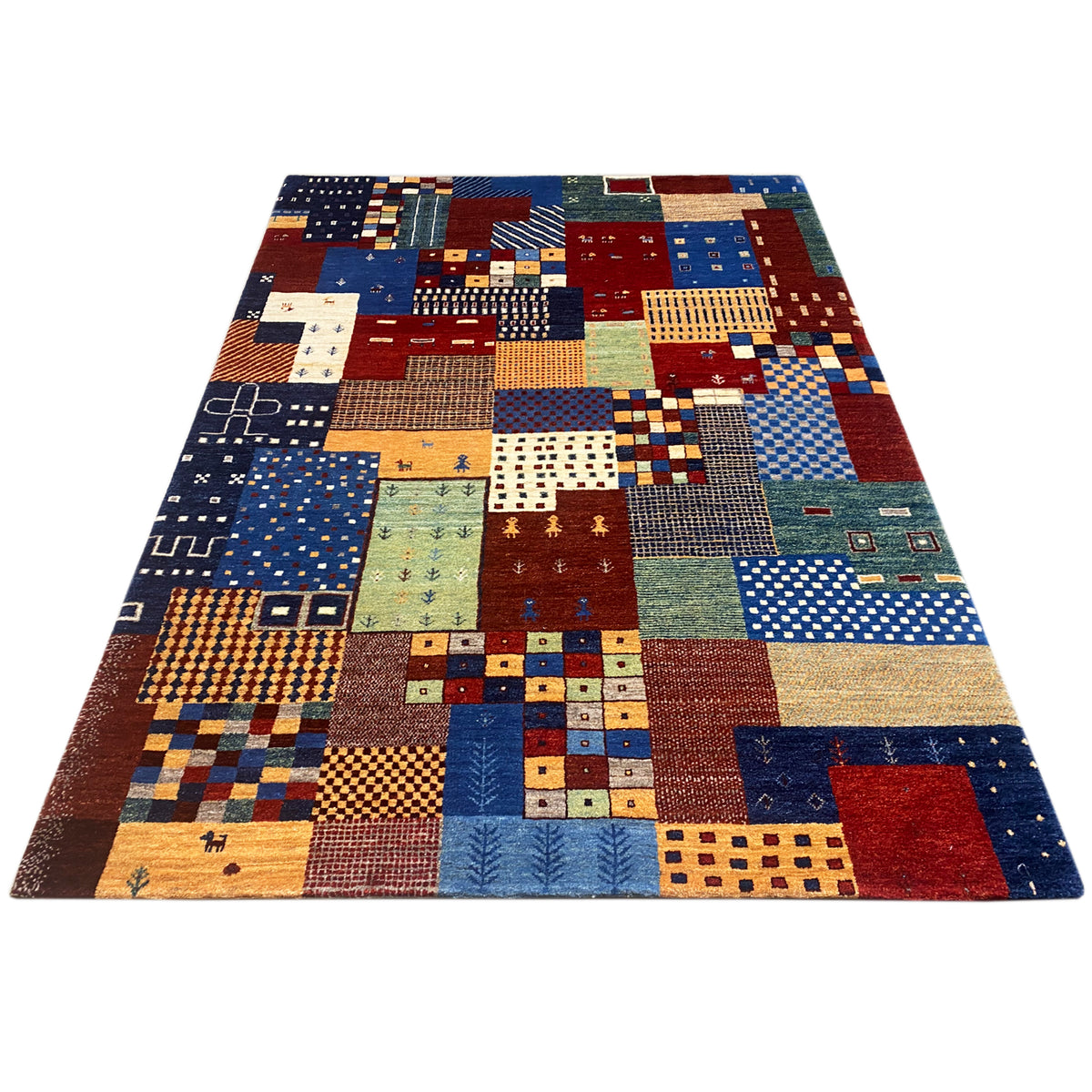 Rectangular Gabbeh rug with a colorful patchwork pattern in blue, red, beige, and green