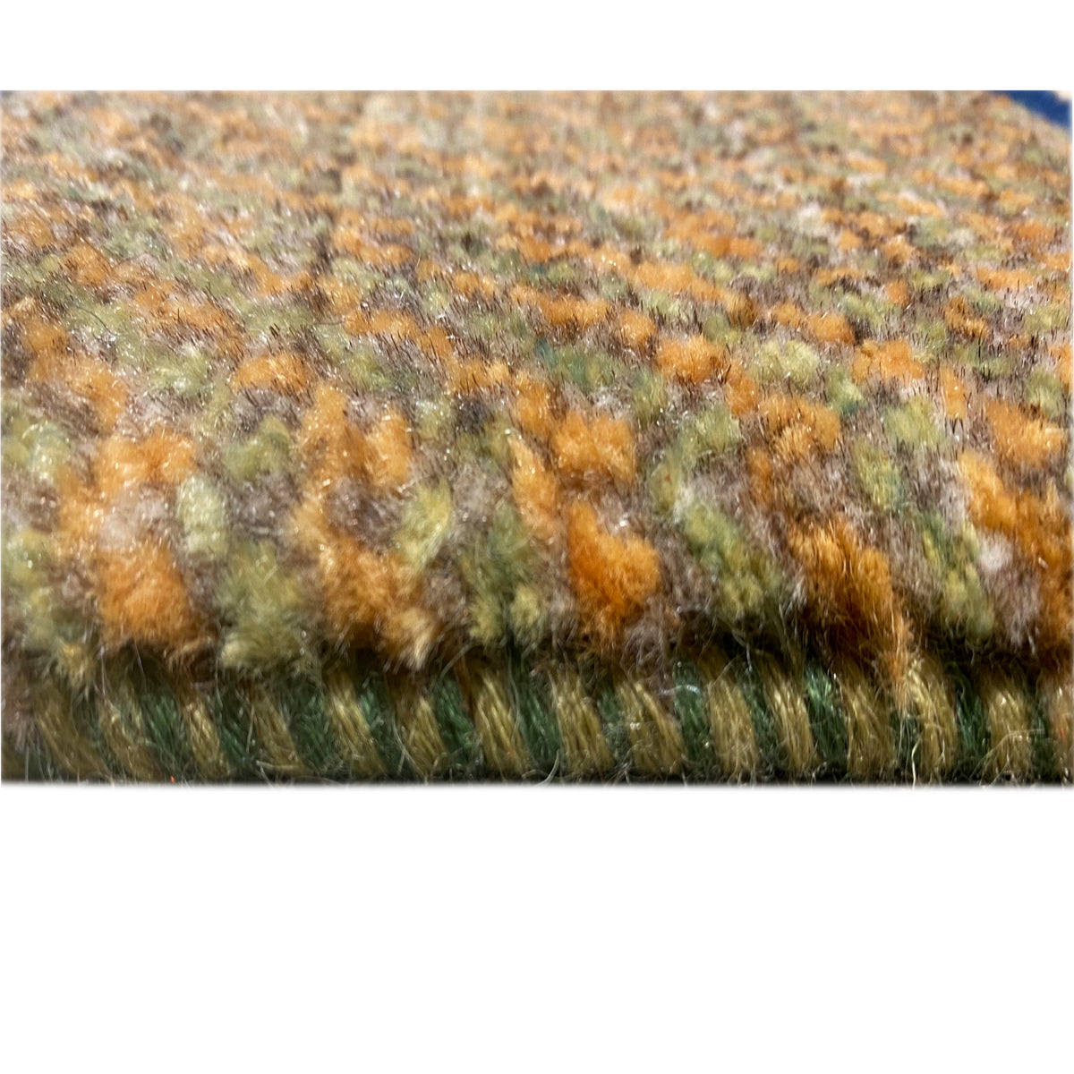 Gabbeh rug close-up of the pile: mixed shades with a dense, fluffy surface