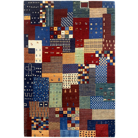 Gabbeh rug with a patchwork design of many colorful squares and patterns, rectangular