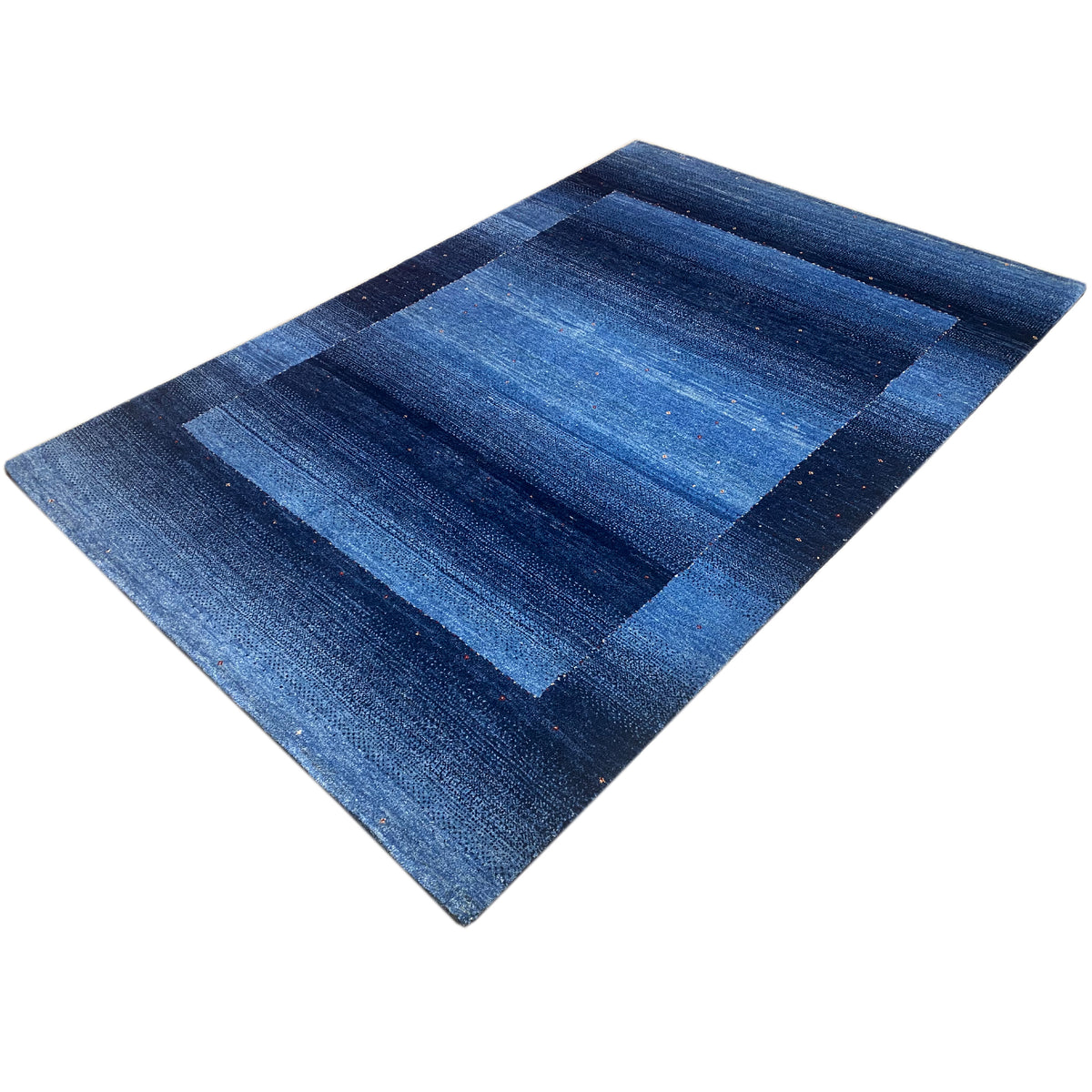 Gabbeh rug in blue with mirrored stripe blocks, shown diagonally