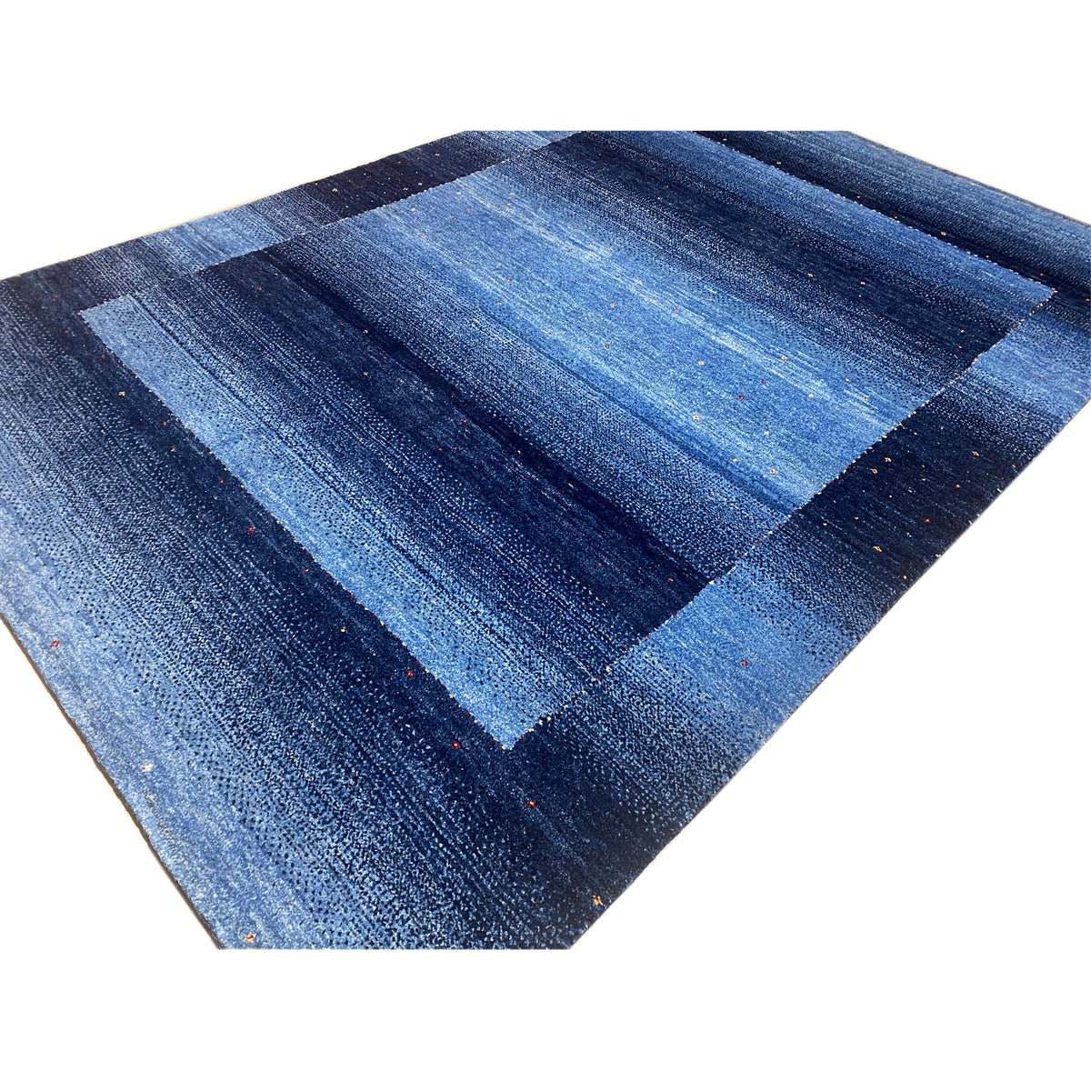 Blue Gabbeh rug, close-up of the diagonal striped pattern with fine flecks of color