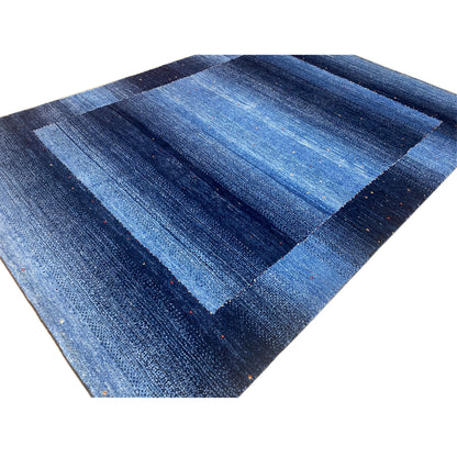 Blue Gabbeh rug, close-up of the diagonal striped pattern with fine flecks of color