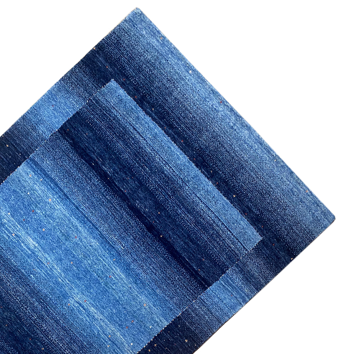Blue Gabbeh rug with clear rectangular stripes, diagonal view of the pattern